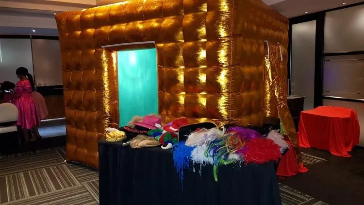 Gold inflatable booth at an indoor event