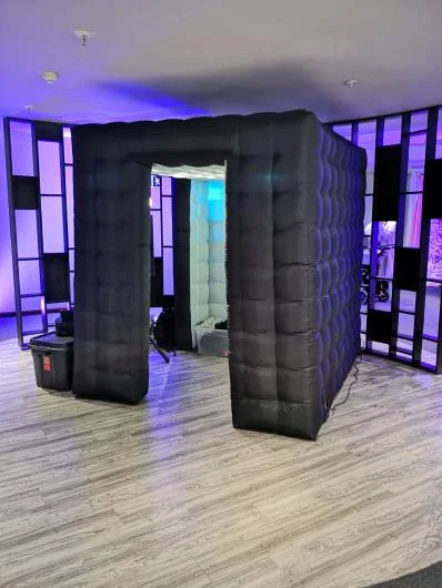 Black inflatable booth with coloured lighting